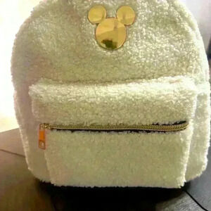 Bioworld Disney white sherpa mini backpack.